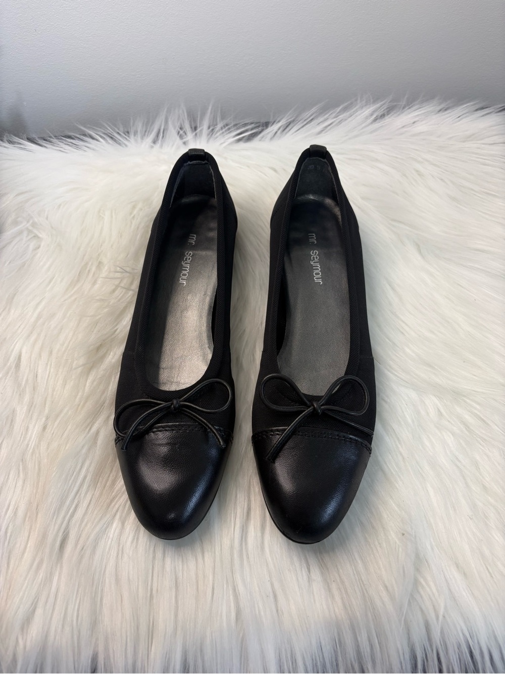 Easy Slip-On Black Ballet Flats with Bow Accent mesh like sides.
